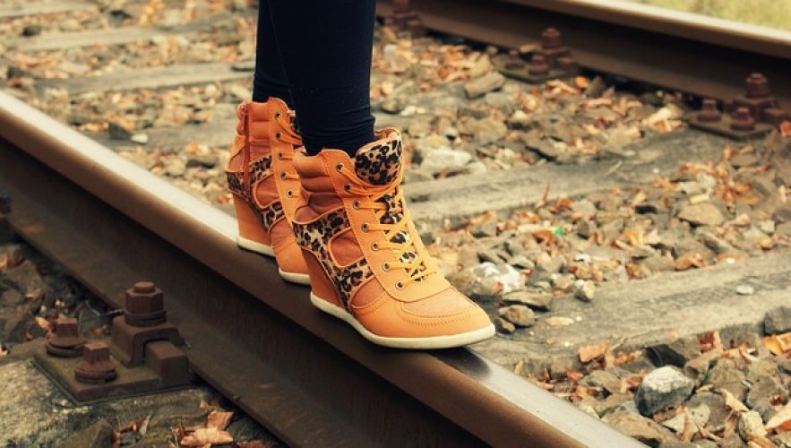 Feet on railway tracks